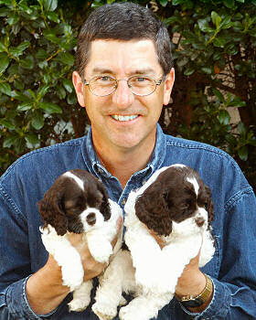Jim Zim with two chocolate puppies in 2002
