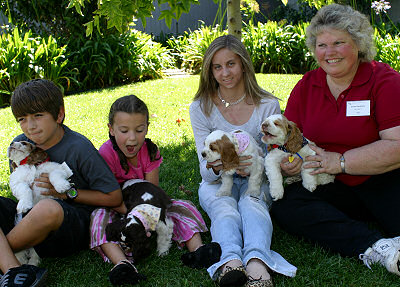 New owners with their Zim puppies